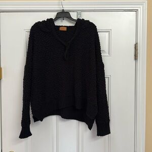 Black v-neck hooded sweater